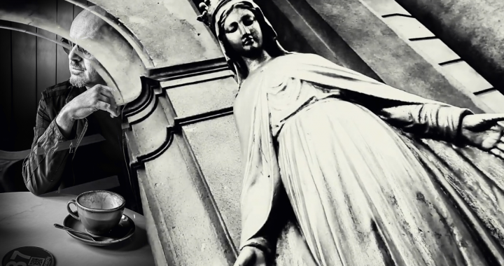 Perry Blake photo with a statue of Mary, Mother of God.